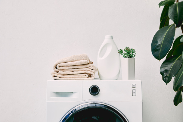 stock-photo-detergent-bottle-towels-washing-machine